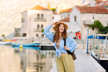 Happy woman tourist enjoying great cityscape. Travel or study in Europe. Lifestyle, rest, vacation concept.