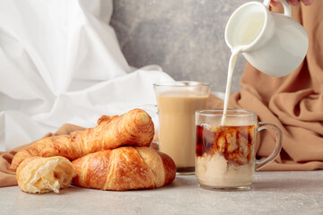 Croissants and coffee with cream.