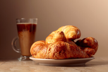 Freshly baked croissants and coffee with cream.