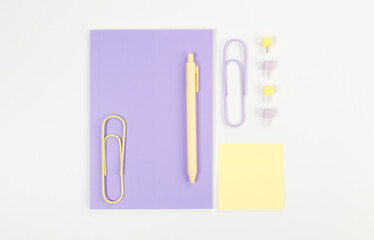Top view of purple notebook on white background. Sticky note, paperclips, pen and pins. School, office wallpaper. Flat lay, copy space.