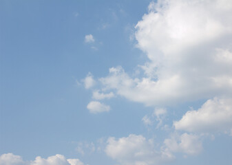 Blue sky and white puffy clouds.