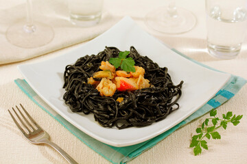 Black tagliatelle with seafood.