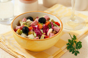 Mixed salad with ham.