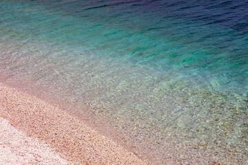 Obraz premium Padulella beach in Tuscany, Elba island. the crystal clear waters of the Elba island seen from the drone