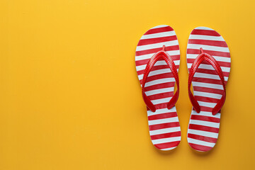 Red and White Striped Flip-flops on a Yellow Background