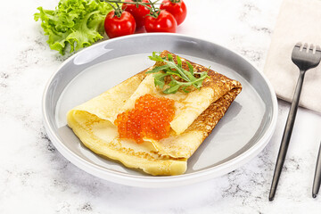 Russian pancake with red caviar