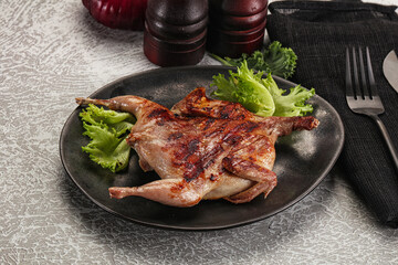 Grilled quail in the plate