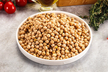 Dry chickpea seeds heap in the bowl
