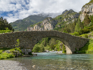 San Nicolas de Bujaruelo Romanesque bridge. Bujaruelo Valley. Ara River. Aragonese Pyrenees. Spain