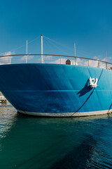 Large ship with white anchor on the bow, departing