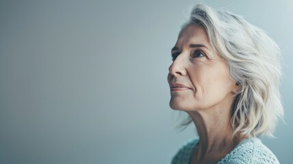 A portrait of a woman with gray hair, ideal for use in various themes and stories