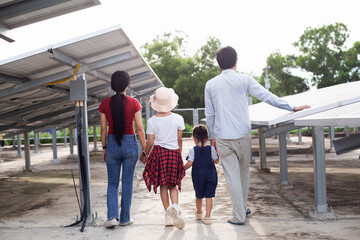 A modern father shows the potential of alternative energy to his family.
