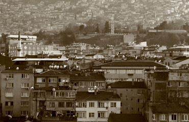 Panoramic view of the historic park of the city of Bursa (Turkiye) with many mosques with sepia effect