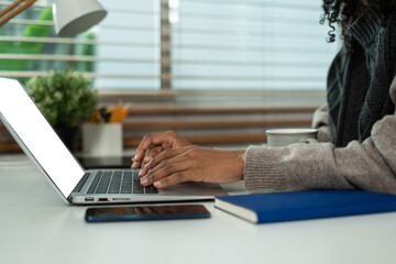 Learning online working concept. Businesswoman working on tablet and laptop computer, searching working in office.