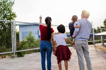 A modern father shows the potential of alternative energy to his family.