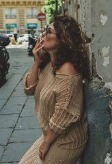 Bad habits in people's life. Addiction concept. Woman smoking cigarette in Italy