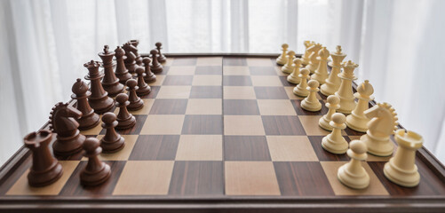 Chess game board with pieces in initial position of the game