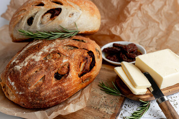 Savor Rustic Artisan Bread with butter, olives for a delicious blend of crunchy and rich flavors