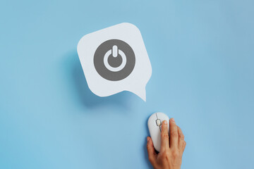 For start, restart business, switch on off , online, offline concept. Start icon on real speech bubble paper cut and hand using wireless mouse on blue background