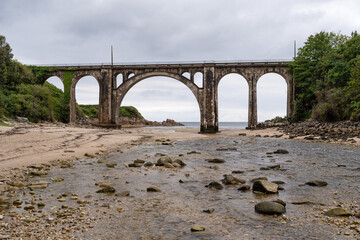 Fototapeta premium Bridge over the Xunco River. Rueta Cove. Fontao, Burela. Lugo, Galicia