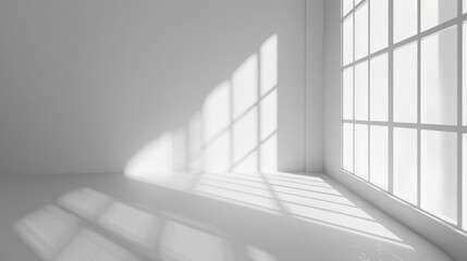 Fototapeta premium A simple room with a large window and white walls, suitable for use in minimalist interior design or educational settings
