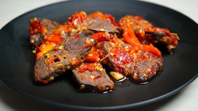Lung beef (paru balado) cooked in spicy balado seasoning, which is sure to arouse appetite, selective focus and close up