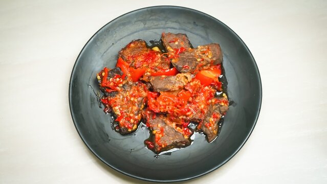 Lung beef (paru balado) cooked in spicy balado seasoning, which is sure to arouse appetite, selective focus and close up