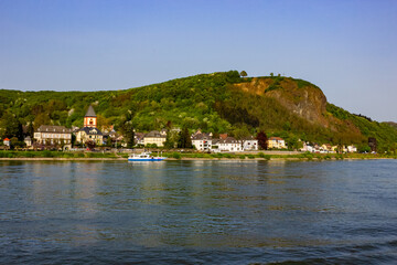 Cityscape of Erpel with Erpeler Ley, St. Severinus Church, lush hills and Rhine River, Germany