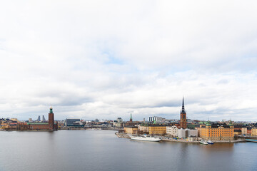 Naklejka premium Cityscape of Stockholm, Sweden. Islands Gamlastan and Kungsholmen. Stockholm City Hall and Riddarholmen Church.