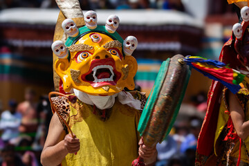 A colorful mask dance and drum beating being performed at Hemis Monastery at Leh, Ladakh India.