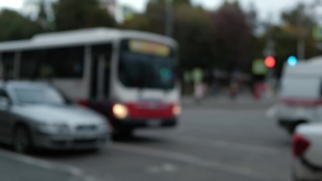 ambulance car rushes along the city highway overtaking other cars. slow motion. close-up.
