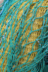 Nylon fishing nets in different colours and states of repair