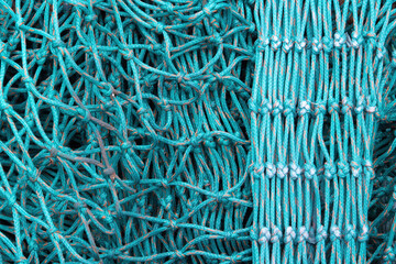Nylon fishing nets in different colours and states of repair