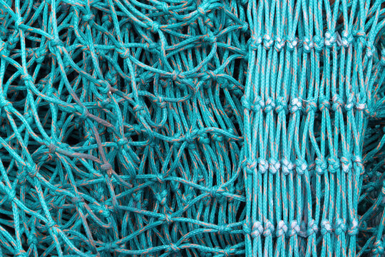 Nylon fishing nets in different colours and states of repair