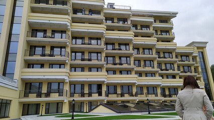 ISTRA, RUSSIA - AUGUST 2019 Girls from the hotel balcony of Mistral Hotel welcome a friend