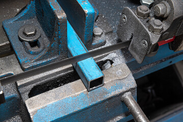 Metal cutting Horizontal Band Saw, part way through cut. Metal saw.