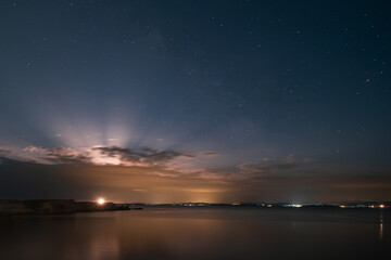 Dawn breaking over the cliffs of Bonifacio and Mediterranean sea on the south coast of Corsica with the coastline of Sardinia in the distance