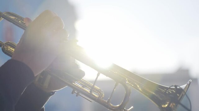 fingers playing trumpet slow motion