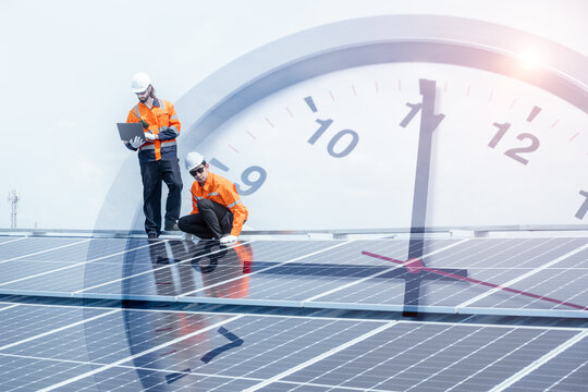 Engineer worker team service solar panel overlay time clock face for time to saving energy concept.