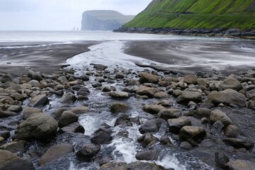 Tjørnuvík beach with Risin and Kellingin sea stacks on horizon. Island of Streymoy, Faroe Islands, Denmark. 