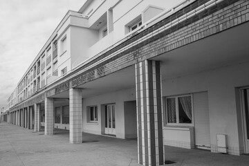 house front on a street, greyscale shot