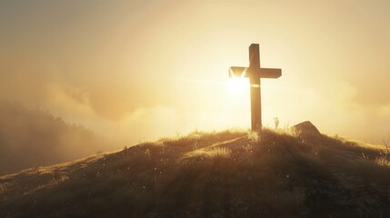 cross on top of mountain with fog and sunlight