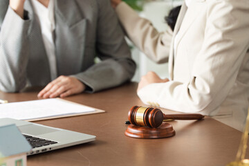 Professional Lawyers Discussing Legal Matters in Office with Gavel and Documents on Desk