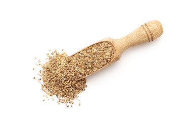 Top view of a wooden scoop filled with Organic Chicory or Kasni (Cichorium intybus) seeds. Isolated on a white background.