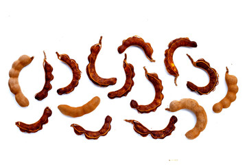 Tamarind fruit on white background.