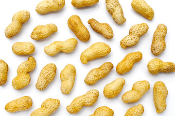 Roasted peanuts in shell on white background.