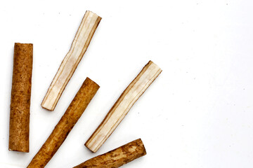 Burdock Root (Gobo) on white background.