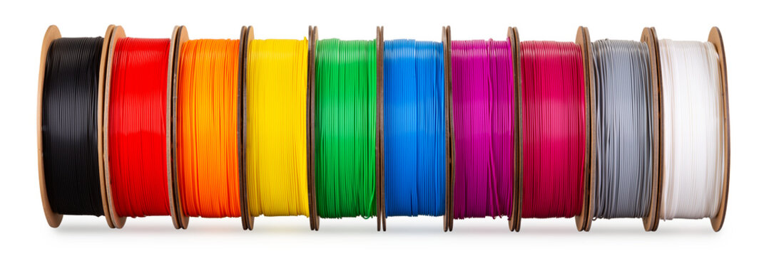 row of colorful  3d printing filament PLA material on environmentally friendly and recyclable paper cardboard spools isolated white background. modern FDM printer technology concept