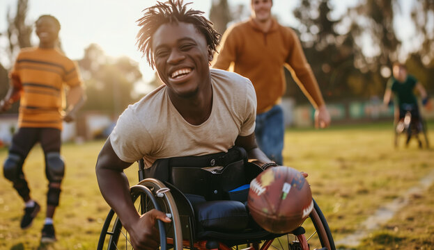 football player with ball. Disabled black rugby player. Happy football player smiling in a wheelchair. disability and diversity representation in sport.