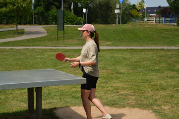 girl playing table tennis